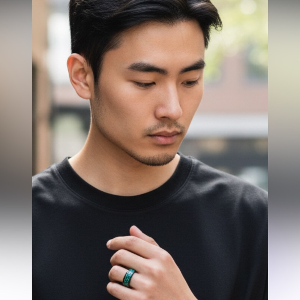 Super nice men’s black metal ring with iridescent green sparkle around center!